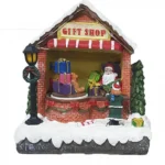 Κεραμικό Χριστουγεννιάτικο Διακοσμητικό με Φώς και Μουσική - Το Κατάστημα Δώρων του Αγιου Βασίλη - 16x10.5x17.5εκ